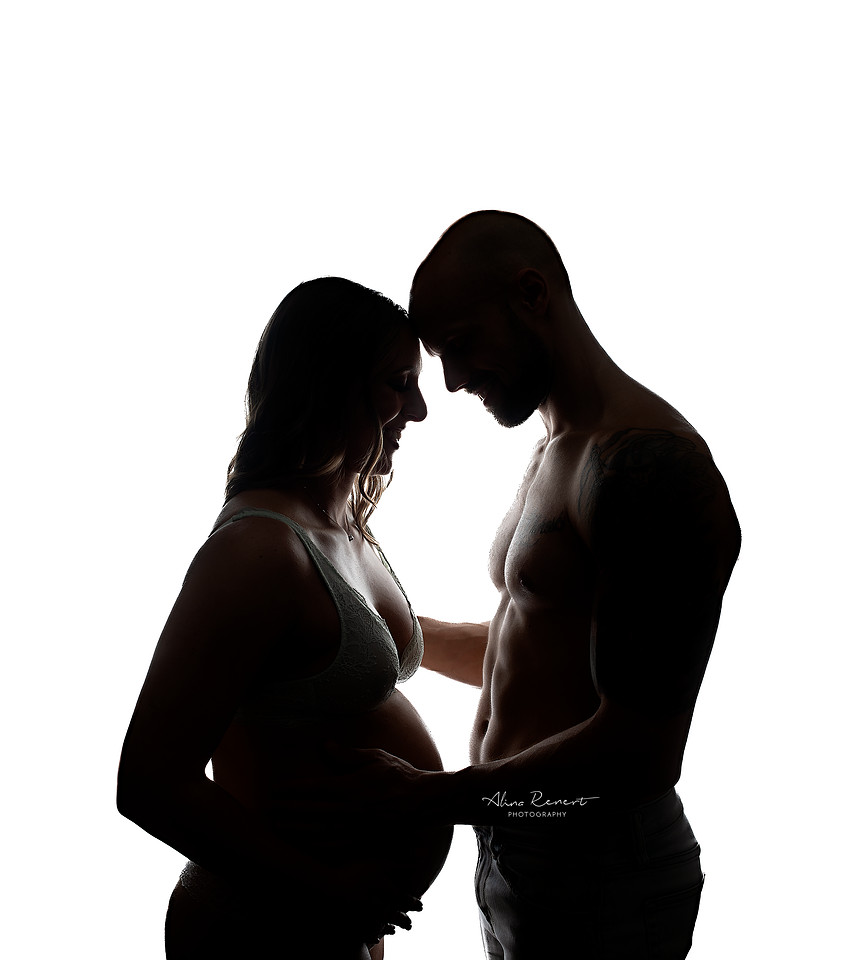 Intimate first pregnancy photo shoot in a Chicago studio, intimate posing for maternity couples.