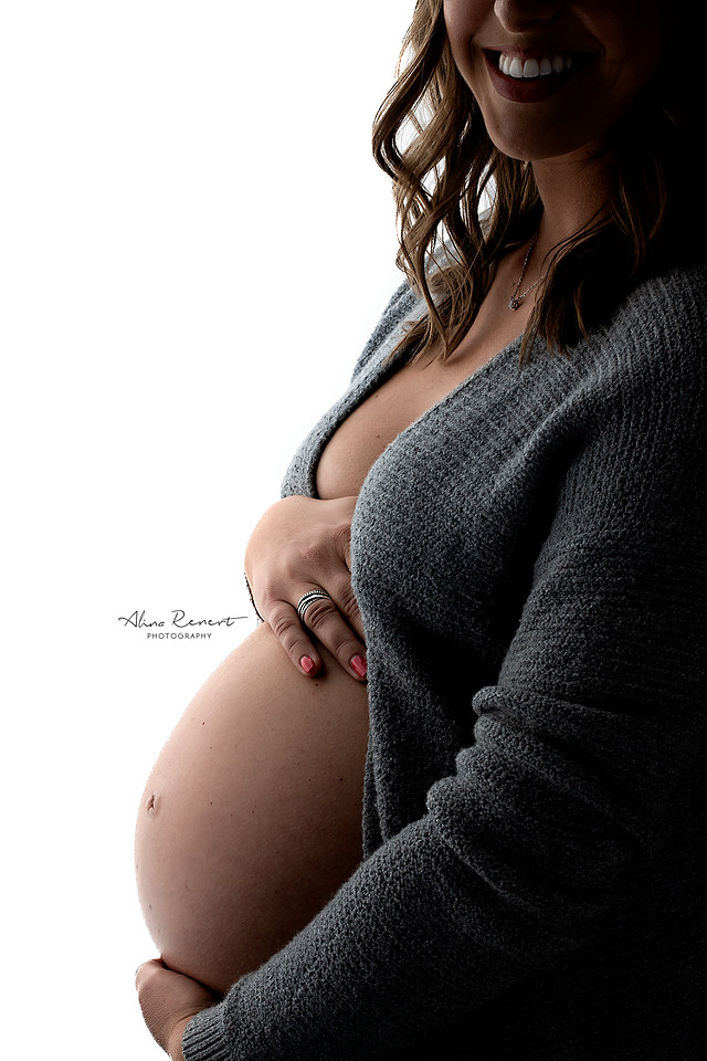 Intimate first pregnancy photo shoot in a Chicago studio, intimate posing for maternity couples.